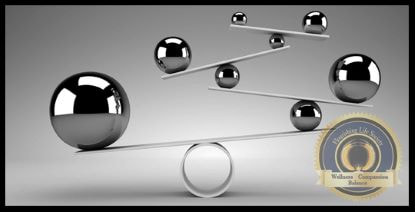 Several balls perfectly balancing. A Flourishing Life Society article on keeping a life in balance