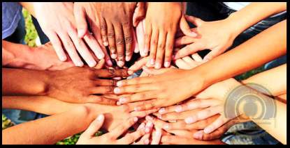 Appreciating Differences. Several hands of different colors on top of each other. Representing acceptance. A Flourishing Life Society article image header