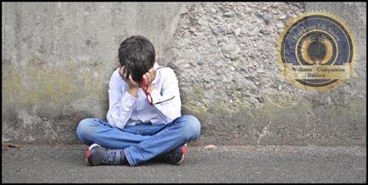 Boy sitting alone. A Flourishing Life Society article on abandonment and engulfment