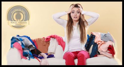 Girl sitting on sofa with accumulating pile of dirty clothing. A Flourishing Life Society article on accumulating problems