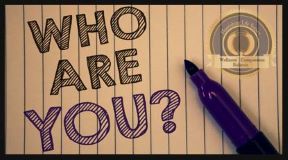 Who are you? written in block letters on old aged paper. A Flourishing Life Society article on Autobiographical Memories