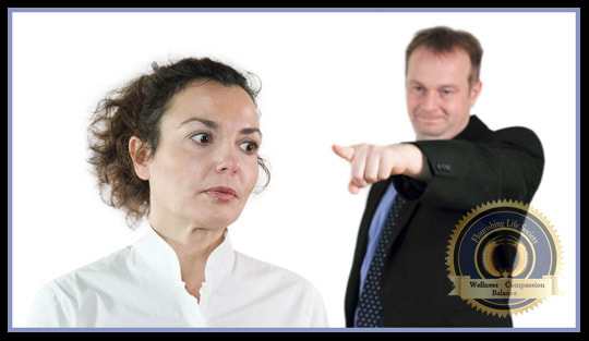 A man pointing his finger at a woman. She has an annoyed expression. A Flourishing Life Society article on the problems of blaming a partner for relationship woes.