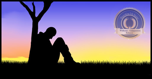 Silhouette of man sitting alone. A Flourishing Life Society article on Loneliness. 