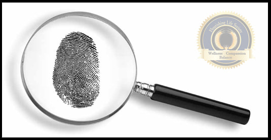 A magnifying glass over a fingerprint. A Flourishing Life Society article on cognitive bias