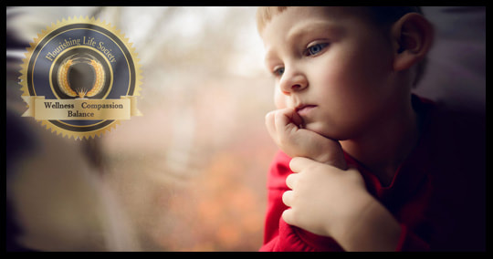 A Young boy with a sad look. A Flourishing Life Society article on embracing our inner child