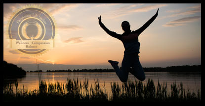 A silhouette of a person jumping with joy. A sunset and lake in the background. A Flourishing Life Society article on emotional fitness.