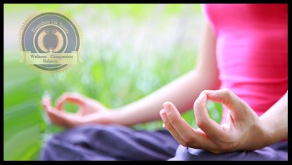 A lady meditating with green nature background. An article on finding peace through mindfulness