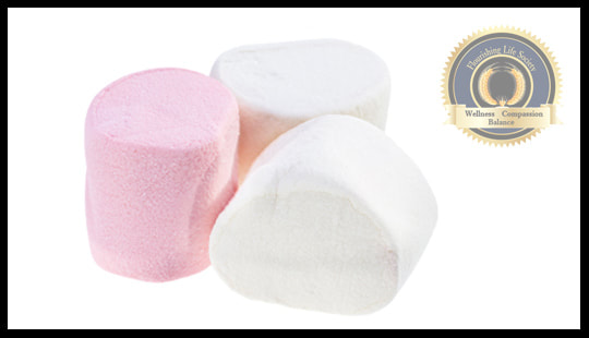 One pink and two white marshmallows. Representing Walter Mischel's research on delaying gratification. A Flourishing Life Society article on Future Minded