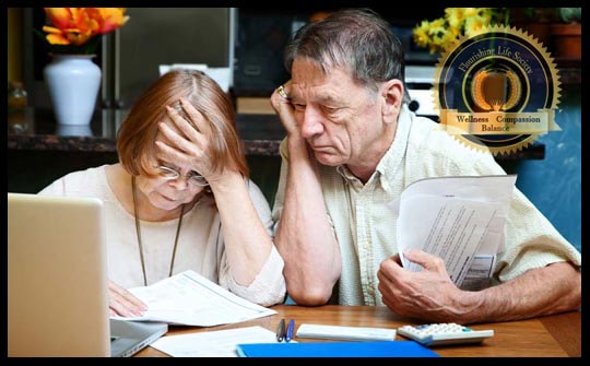 Senior couple in front of computer with bills. They have expressions of anxiety. A Flourishing Life Society article on incessant worry