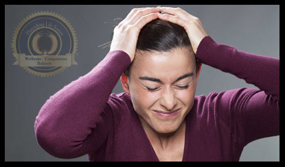 Overwhelmed lady with hands on her head. A Flourishing Life Society article on mental fatigue and emotional regulation