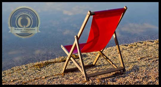  A empty chair on a beach. An article on quieting the overactive mind