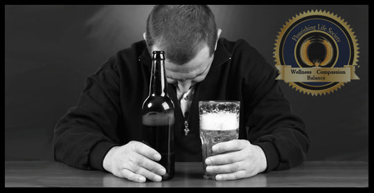A man in despair drinking a beer. An article on emotional pain