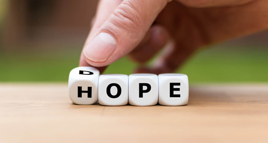 Four dice spelling hope. A Flourishing Life Society article on Addiction. Body image