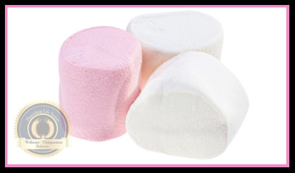 Three marshmallows. Two white and One pink. A Flourishing Life Society article on resisting impulsive behaviors for a larger reward in the future.